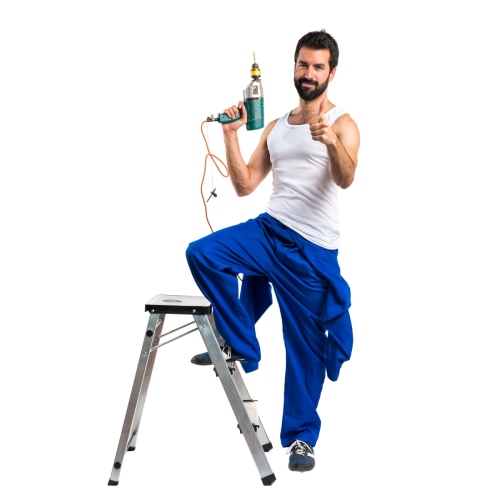 Man in blue pants holding power drill.